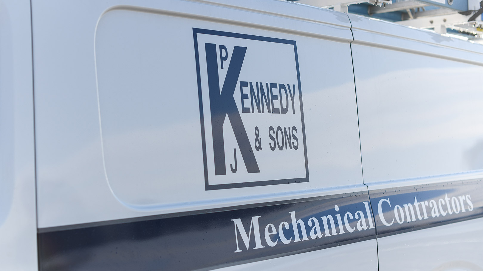 P.J. Kennedy logo on a fleet van.